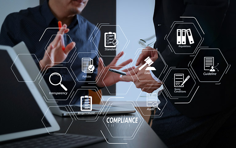 Business professionals review RTO compliance standards on a digital display.